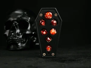 Coffin-shaped dice case with engraved skull design
